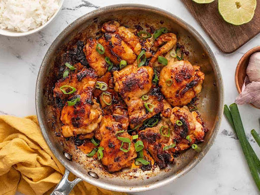 Delicious homemade chipotle chicken served on a plate, garnished with fresh herbs and spices